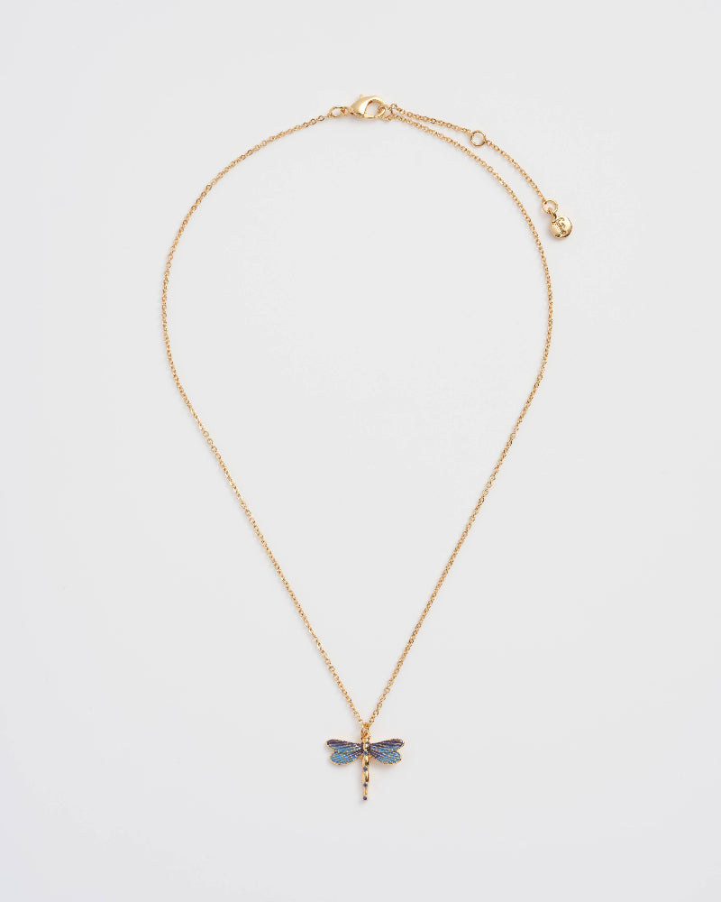 Fable England Gold necklace with a dragonfly pendant on a light gray background