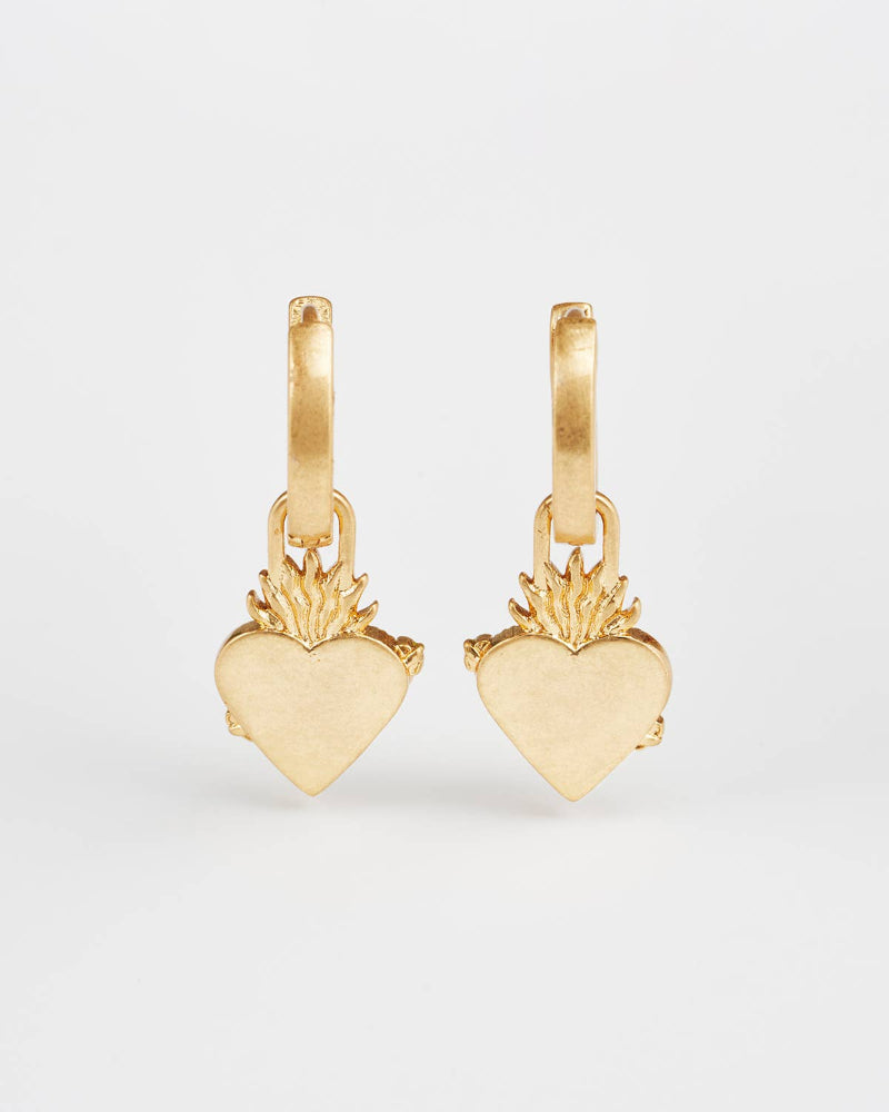 Fable Sacred Heart Huggie Earrings Gold heart-shaped earrings on a white background