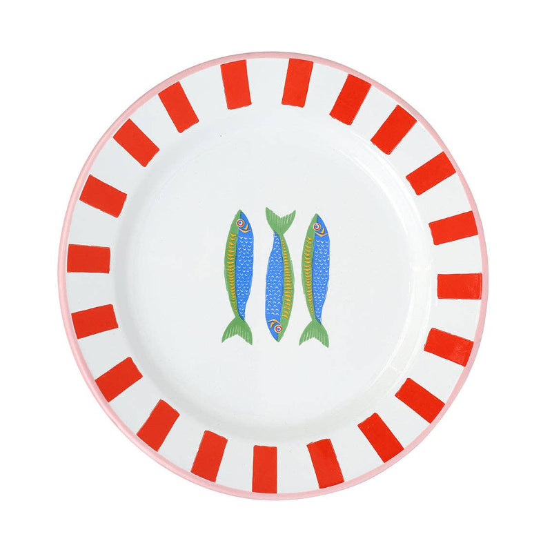 Round plate with red striped border and fish design on a white background