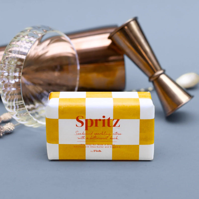Packaged Spritz cocktail mixer with bar tools on a gray background