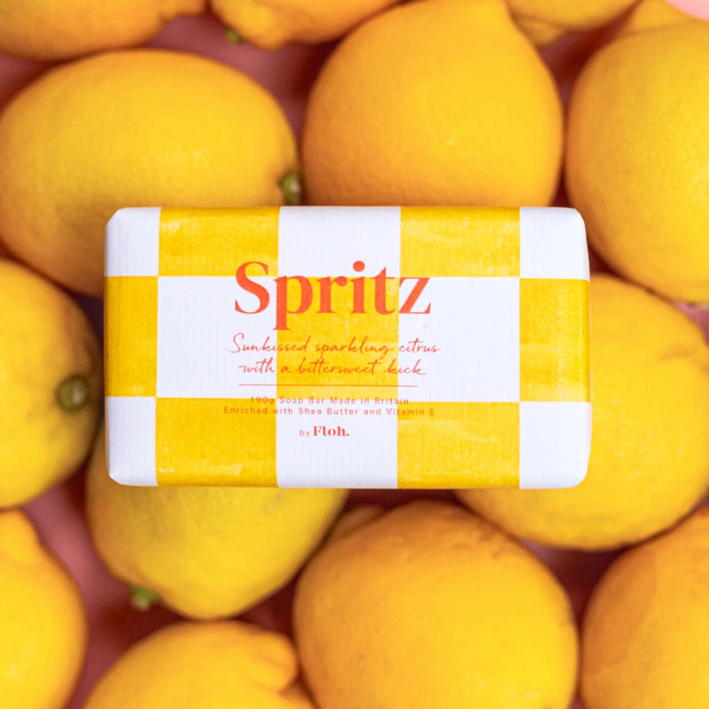 Spritz sparkling citrus product packaging surrounded by lemons