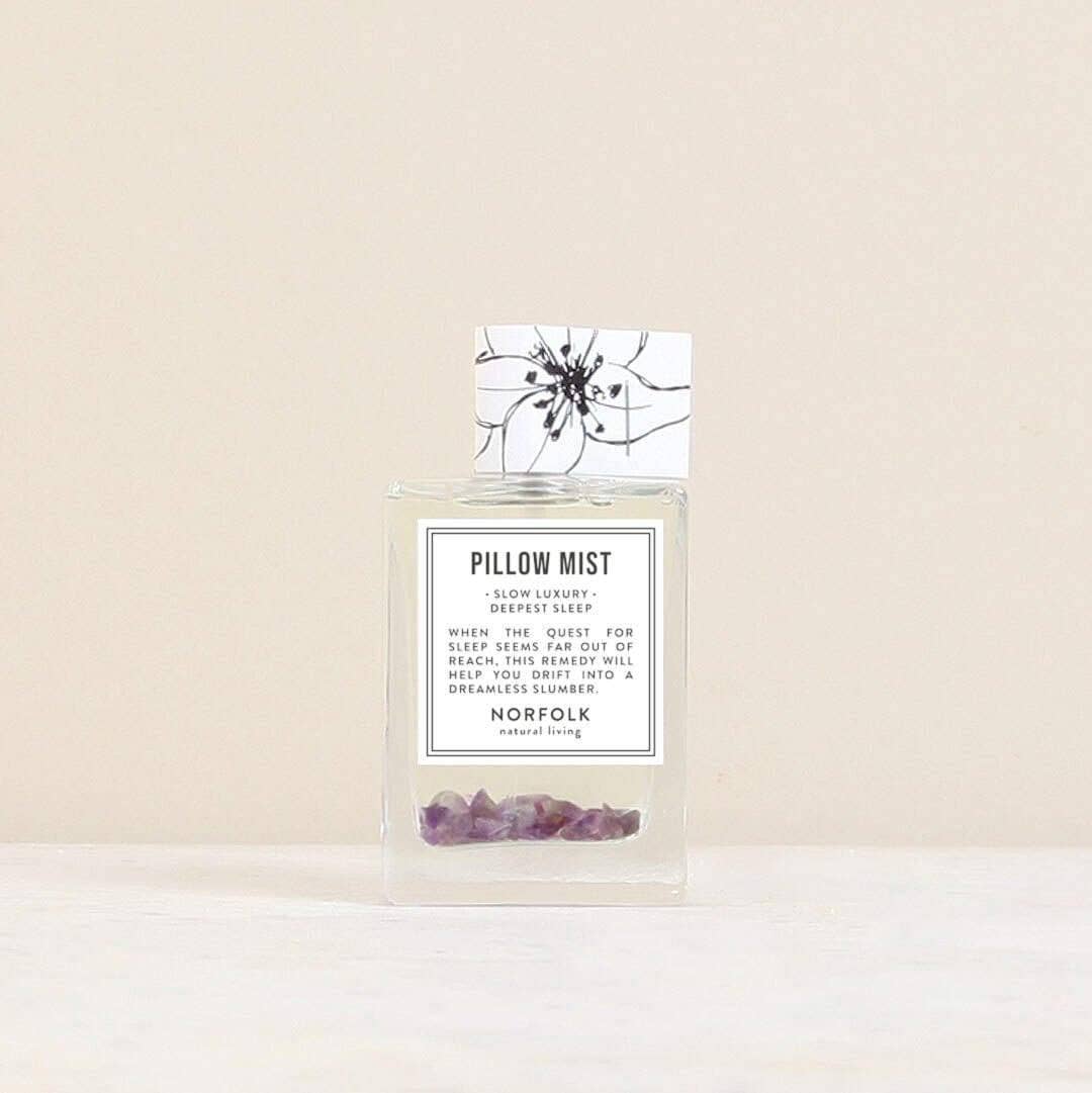 Pillow mist product with packaging on a beige background