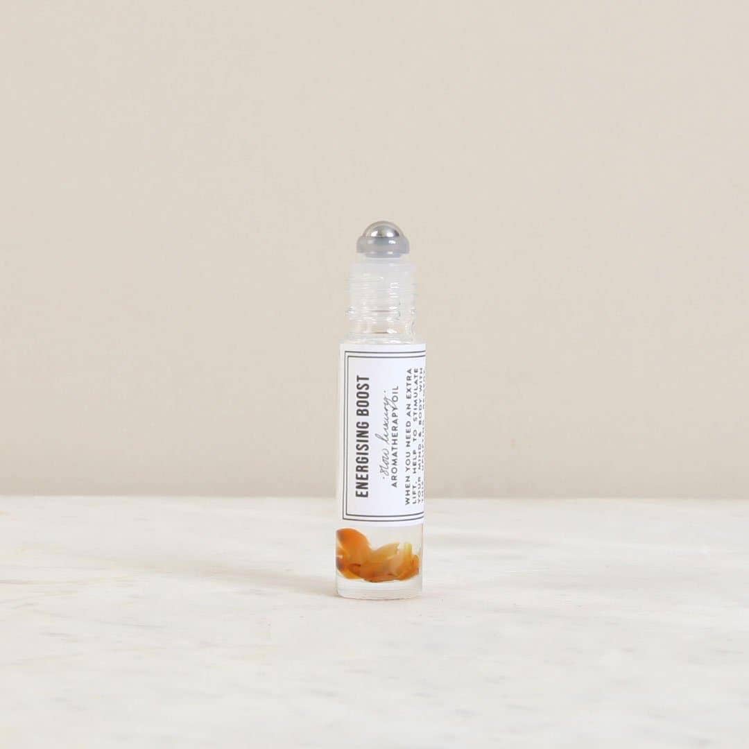 Roll-on bottle labeled 'Energising Boost' on a light beige background