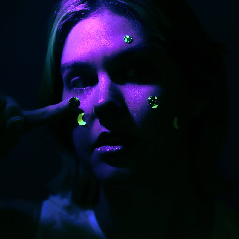 Person wearing glowing Glow in the Dark Hydrocolloid Pimple Patches