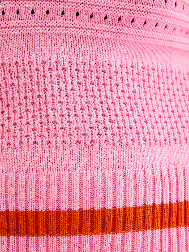 Close-up of pink fabric with a red stripe