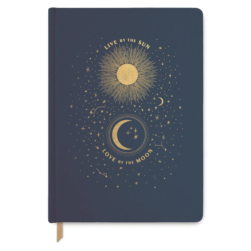 Notebook with celestial design featuring sun and moon on a dark blue background