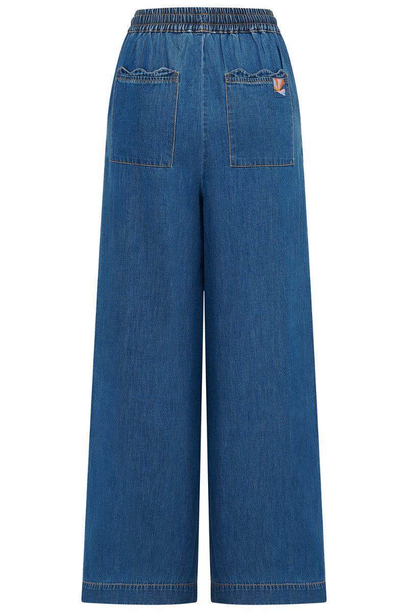Blue denim wide-leg pants on a white background