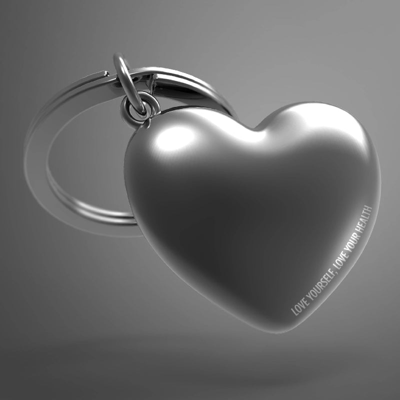 Heart-shaped keychain with 'LOVE YOURSELF, LOVE YOUR HEALTH' text on a gray background