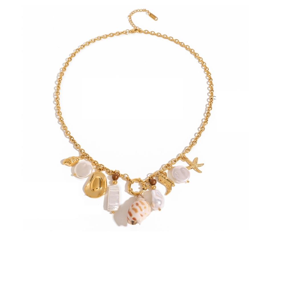 Gold necklace with shell and starfish charms on a white background