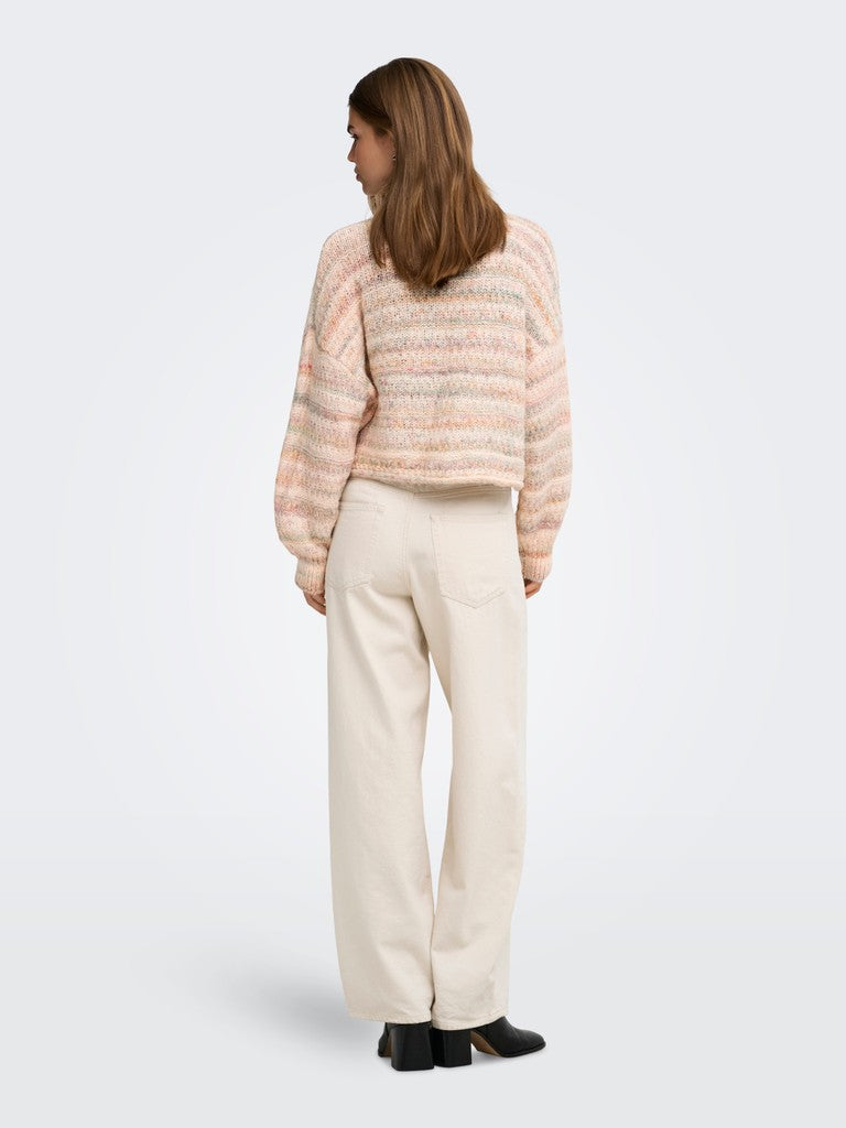 A woman shown from the back wearing a fuzzy striped knit sweater in soft peach, pink, and cream tones, paired with cream-colored wide-leg trousers and black shoes, against a light gray studio background.