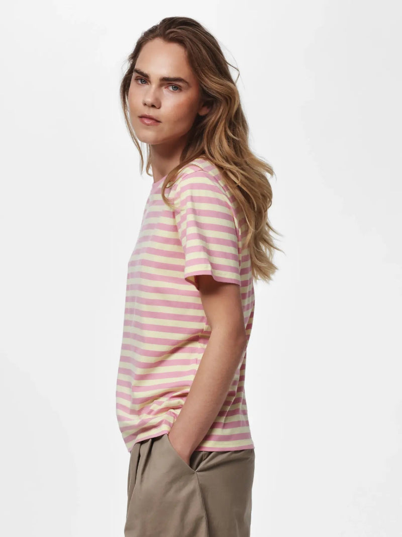 Woman wearing a Pieces Ria pink and white striped shirt on a white background
