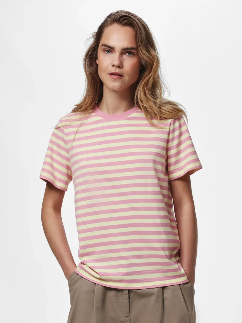Woman wearing a Pieces Ria pink and yellow striped T-shirt on a white background