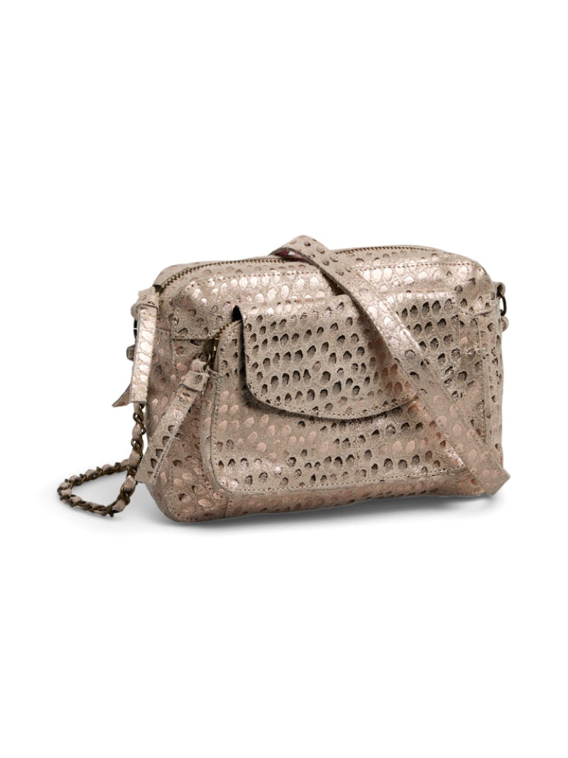 Metallic handbag with perforated design on a white background