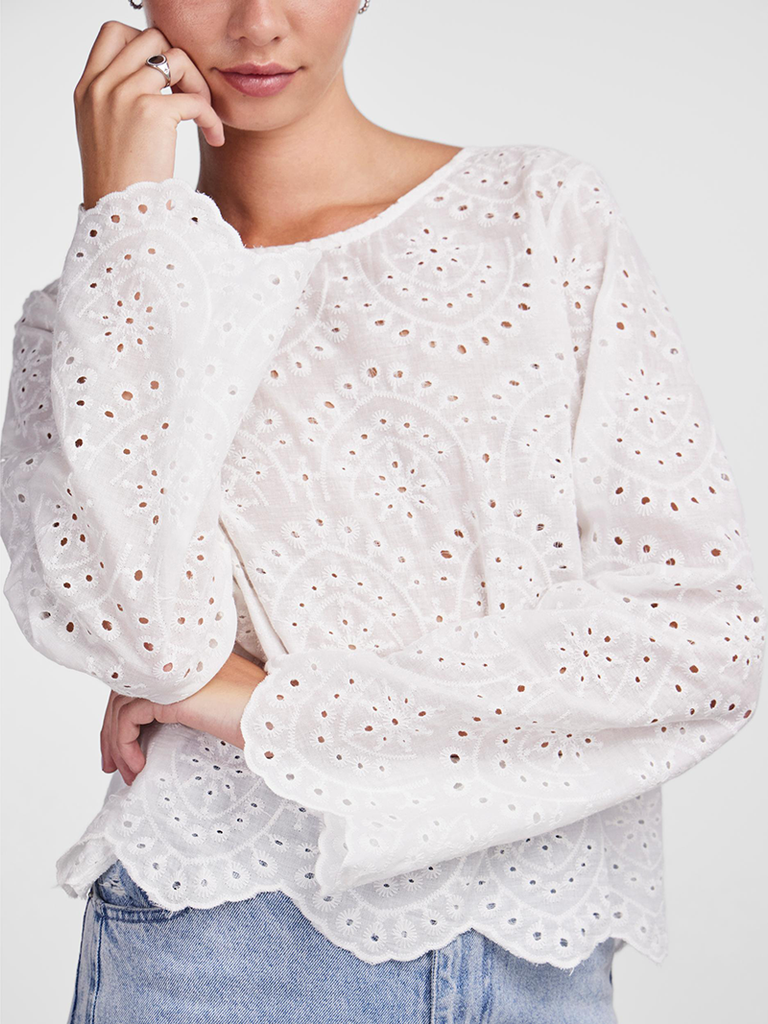 Broderie Anglaise white top with long sleeves and scalloped edges