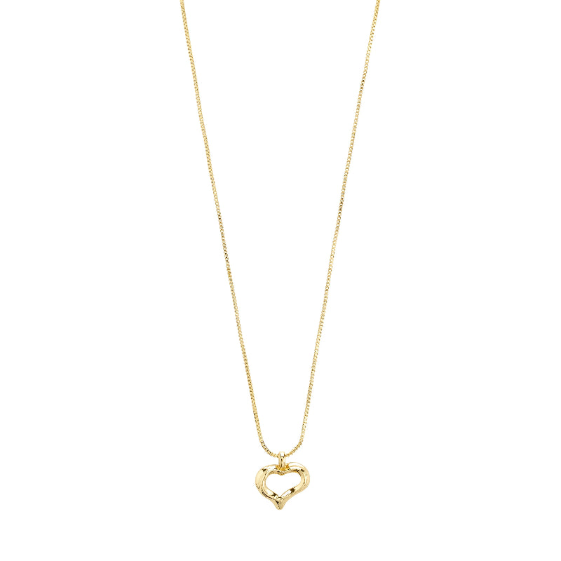 A gold heart necklace on a white background