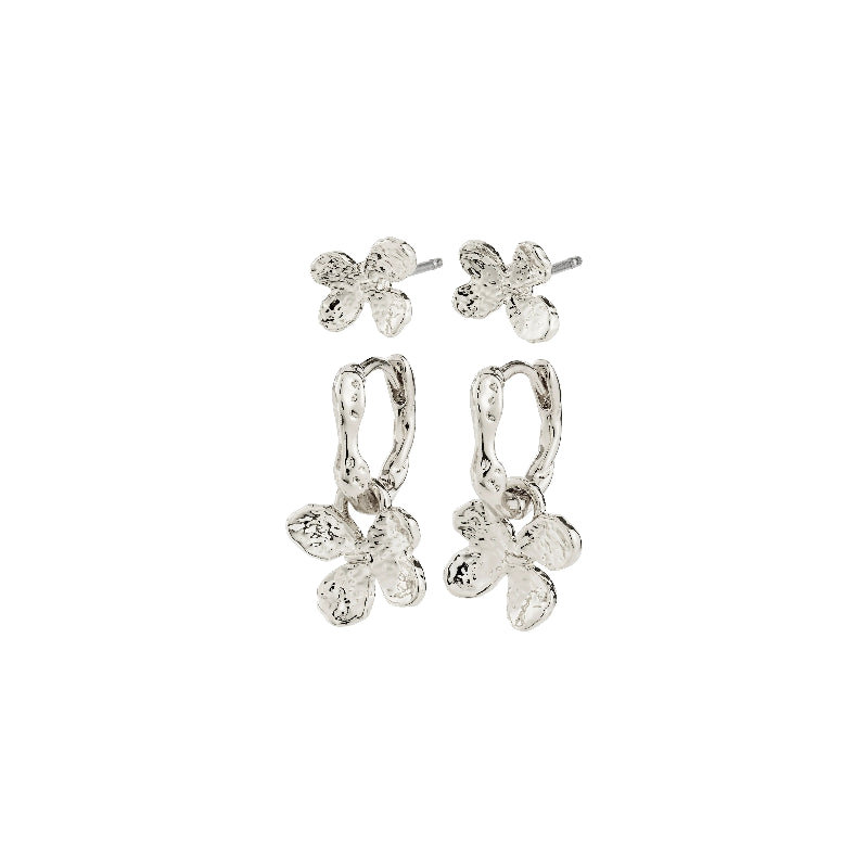 Set of silver earrings on a white background