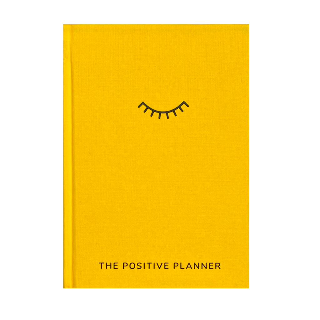 The Positive Planner book in bright yellow