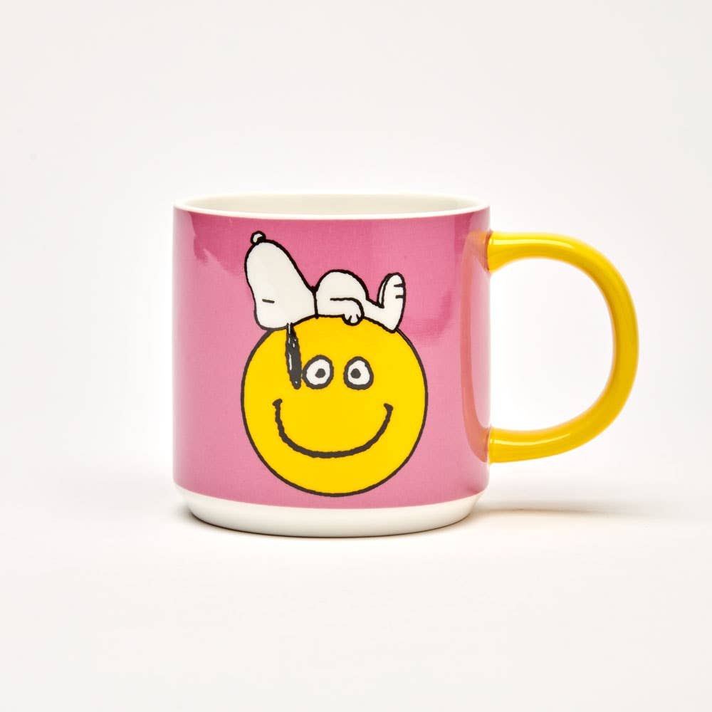 Peanuts Have a Nice Day Mug - snoopy sleeping on a smily face with pink backgraound