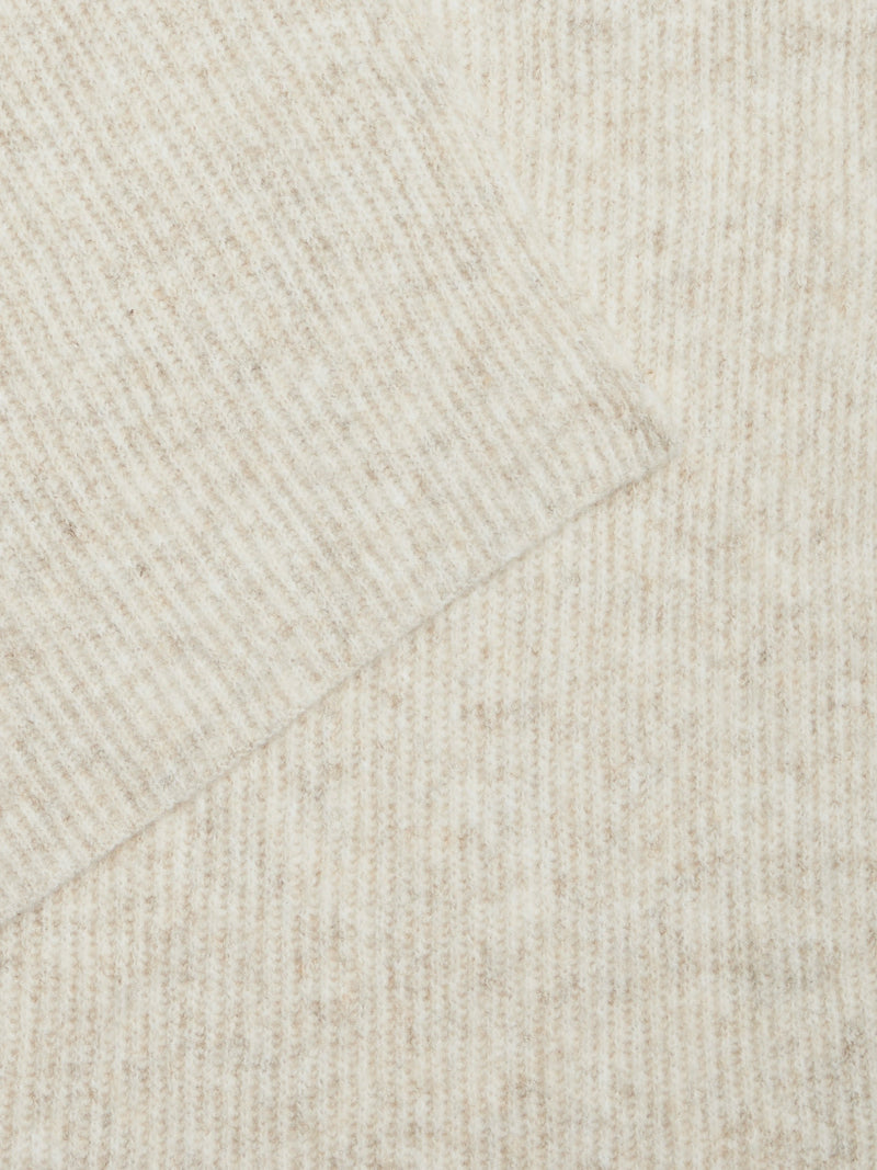 Close-up of beige fabric texture with a subtle pattern