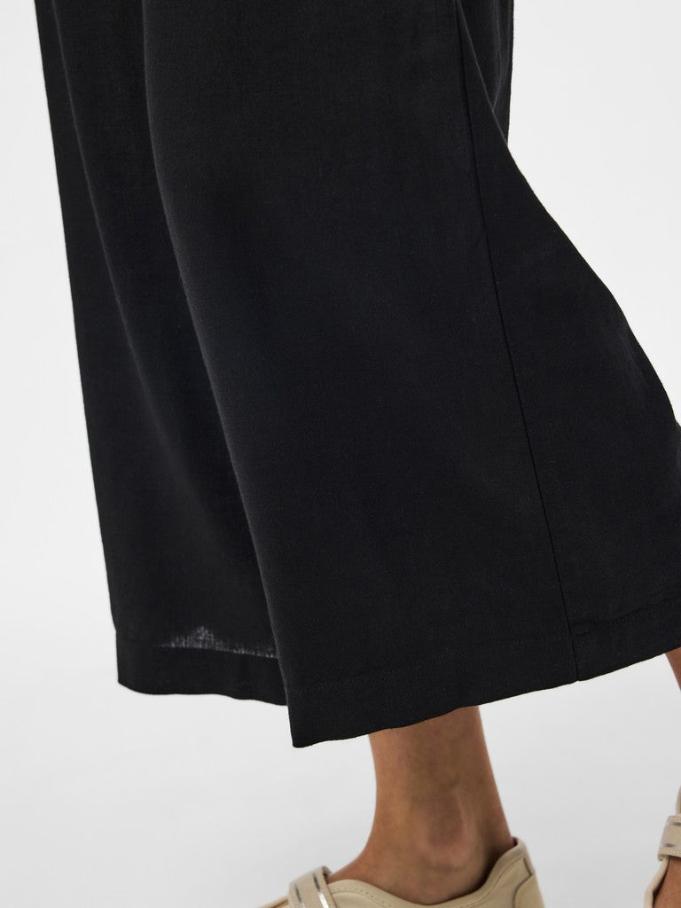 Black wide-leg pants on a white background