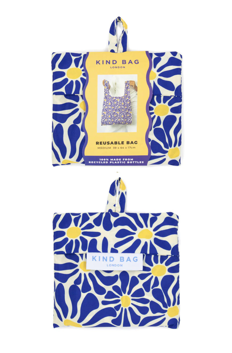 Reusable bag with blue floral pattern and 'Kind Bag' label on a white background