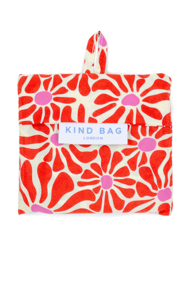 Floral patterned bag with 'Tikind Bag London' label on a white background