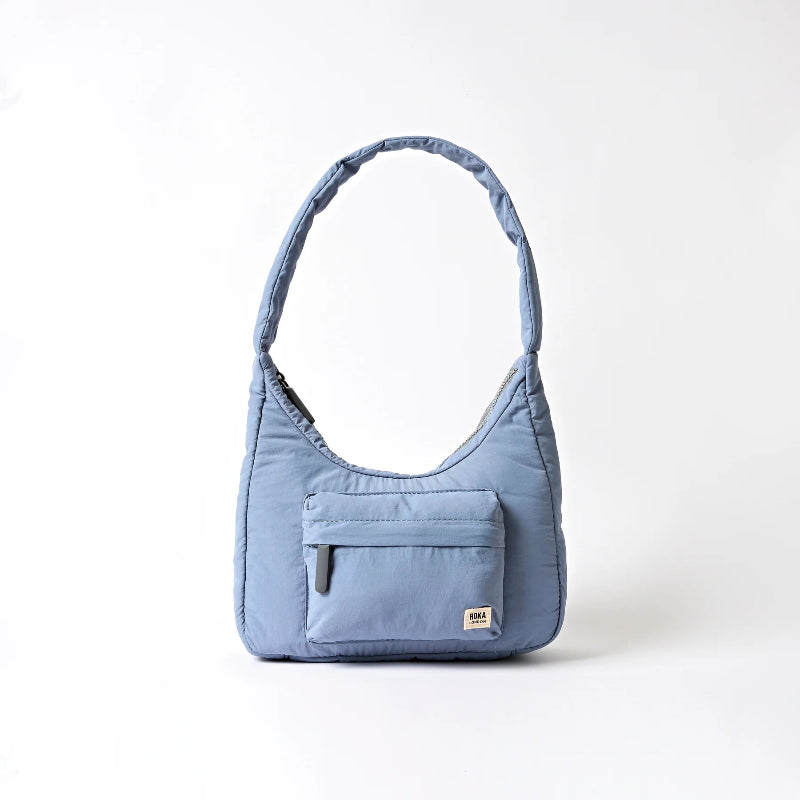 Blue Roka Belize Handbag Retro Blue shoulder bag with a pocket on a white background