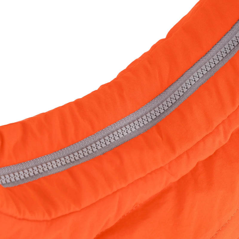 Close-up of an orange fabric with a gray zipper on a white background
