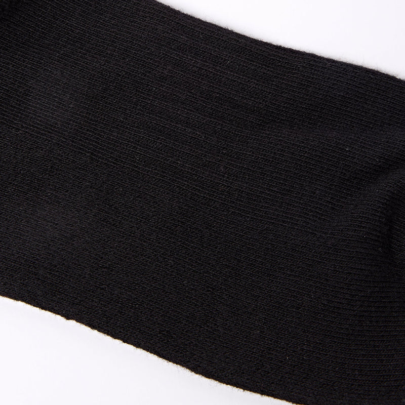 Close-up of a black sock on a white background