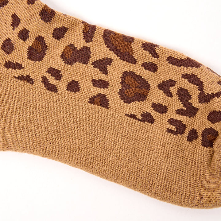 Brown sock with leopard print pattern on a white background