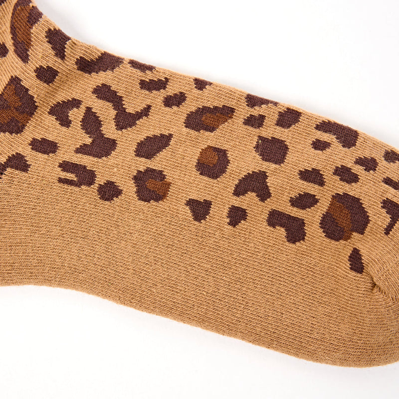 Tan sock with brown leopard print pattern on a white background