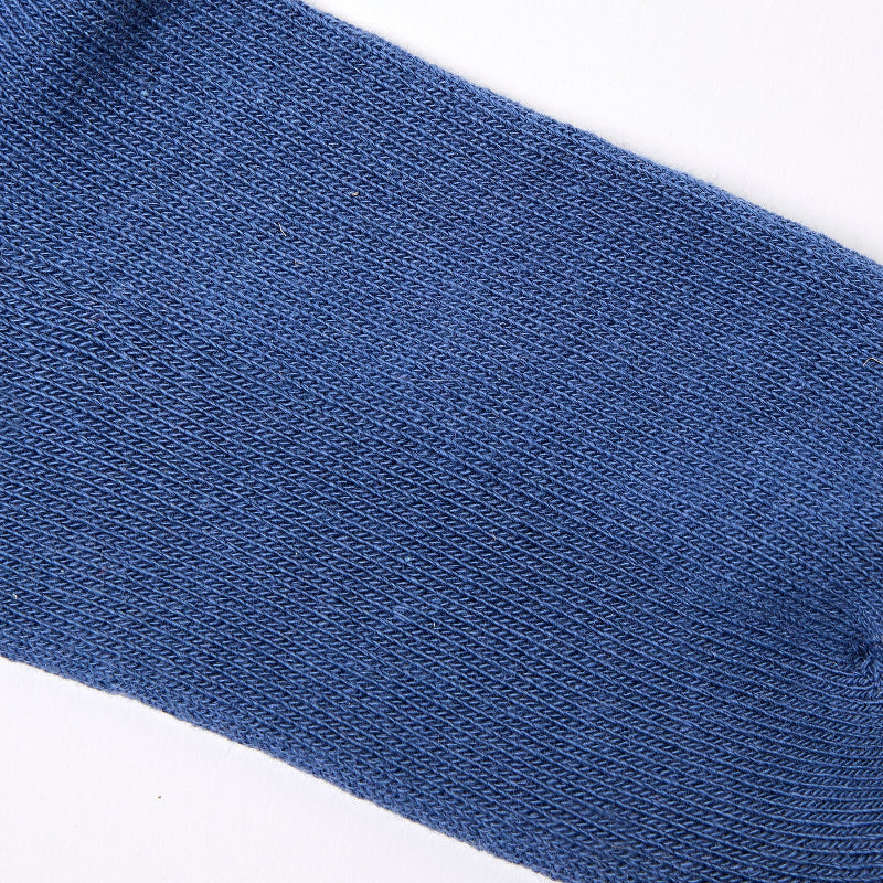 Close-up of a blue sock on a white background