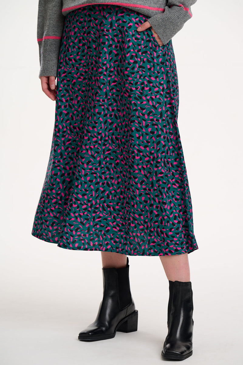Sugarhill  Krista Green Skirt Person wearing a patterned skirt with black boots on a white background