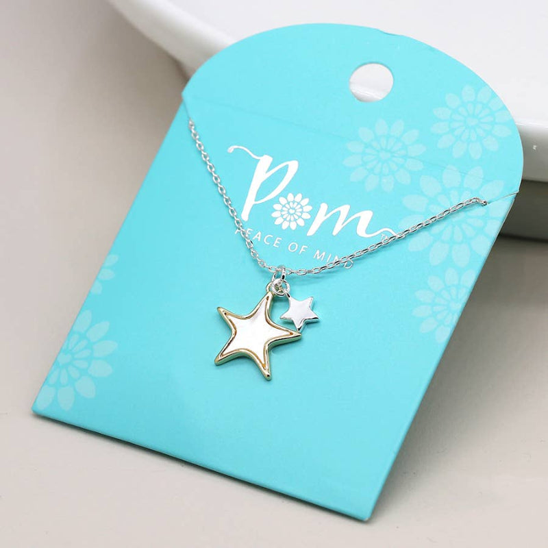 Necklace with star pendant on a blue card with 'Pom' branding.