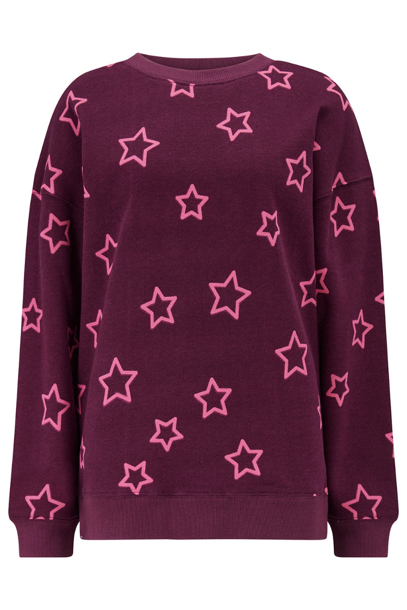 Sugarhill  Spaced Out Stars Sweatshirt with pink star patterns on a burgundy background