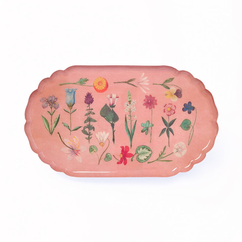 Decorative tray with floral designs on a pink background