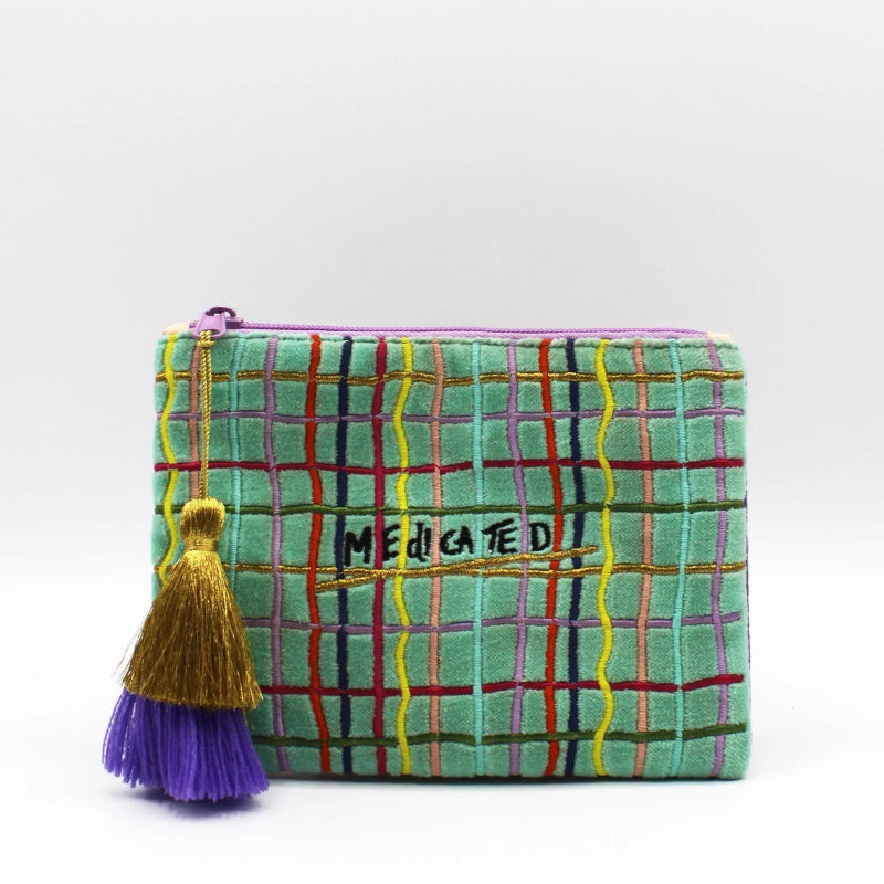 Colorful plaid pouch with a tassel on a white background