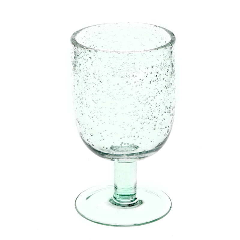 Clear glass wine glass with bubble texture on a white background