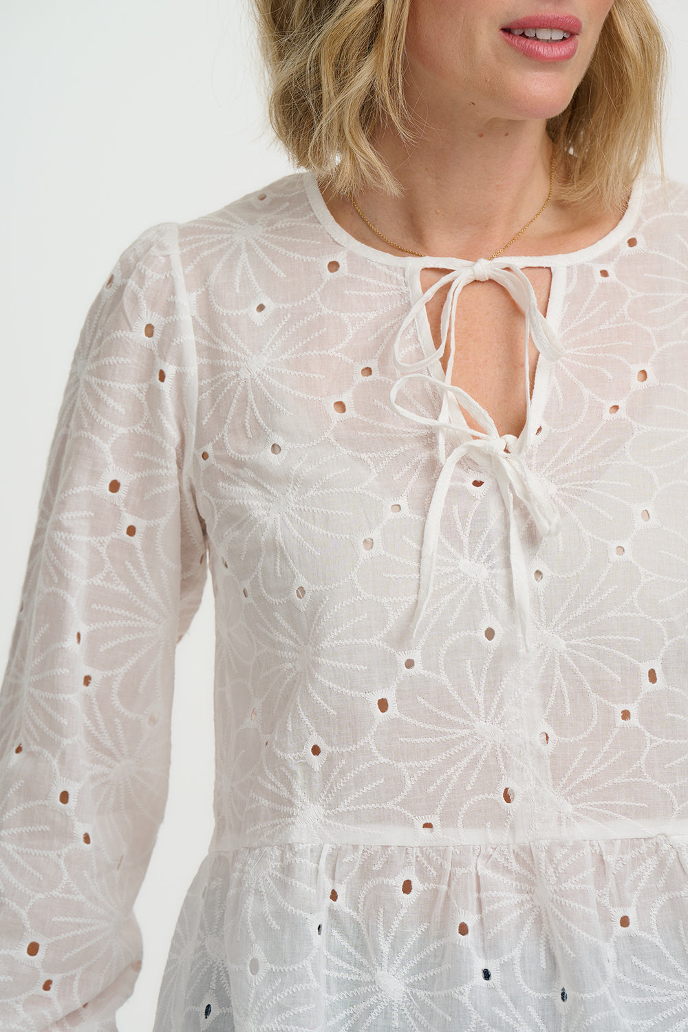 Sugarhill Broderie Anglaise Morgan Top with long sleeves on a plain background