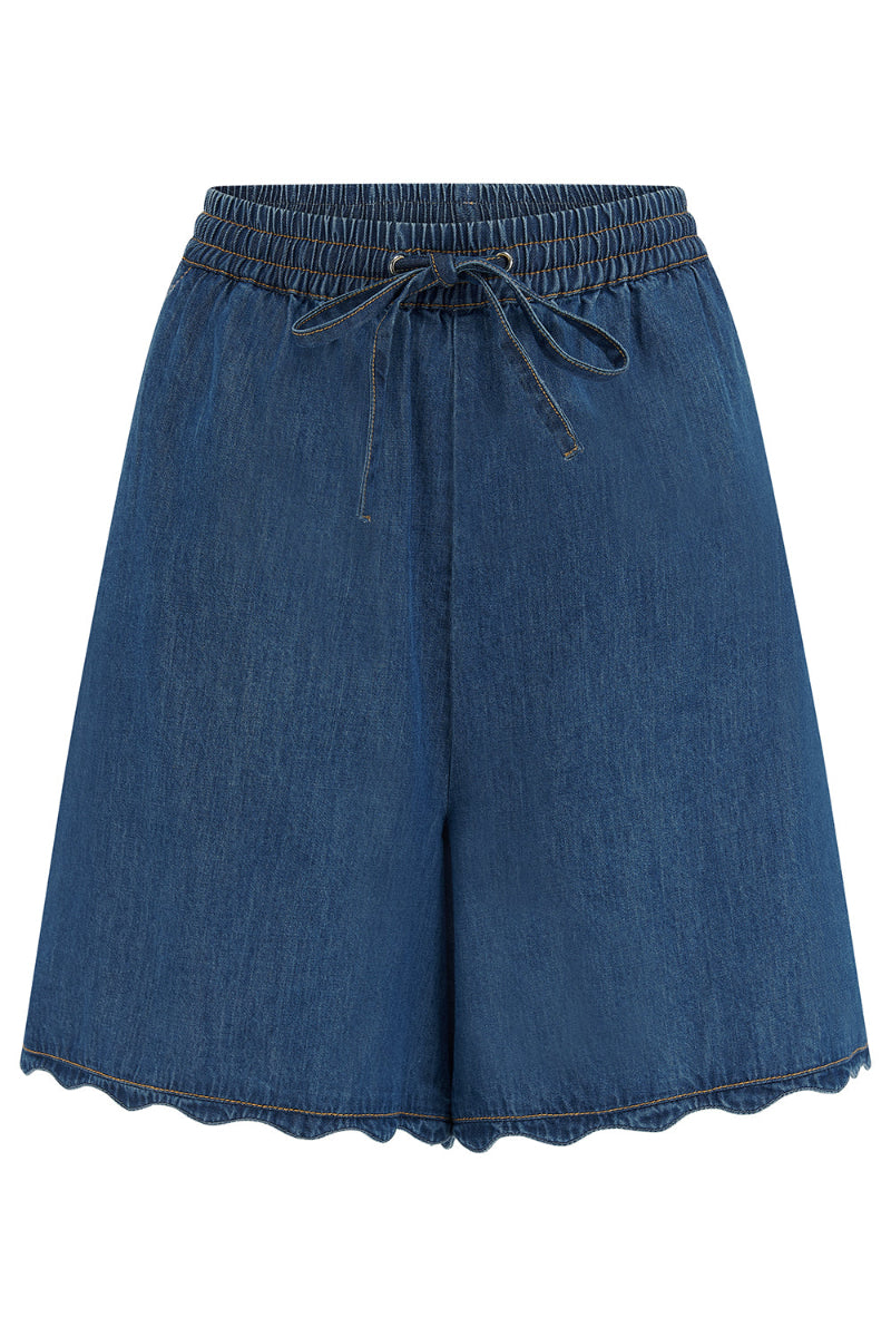 Blue denim shorts on a white background