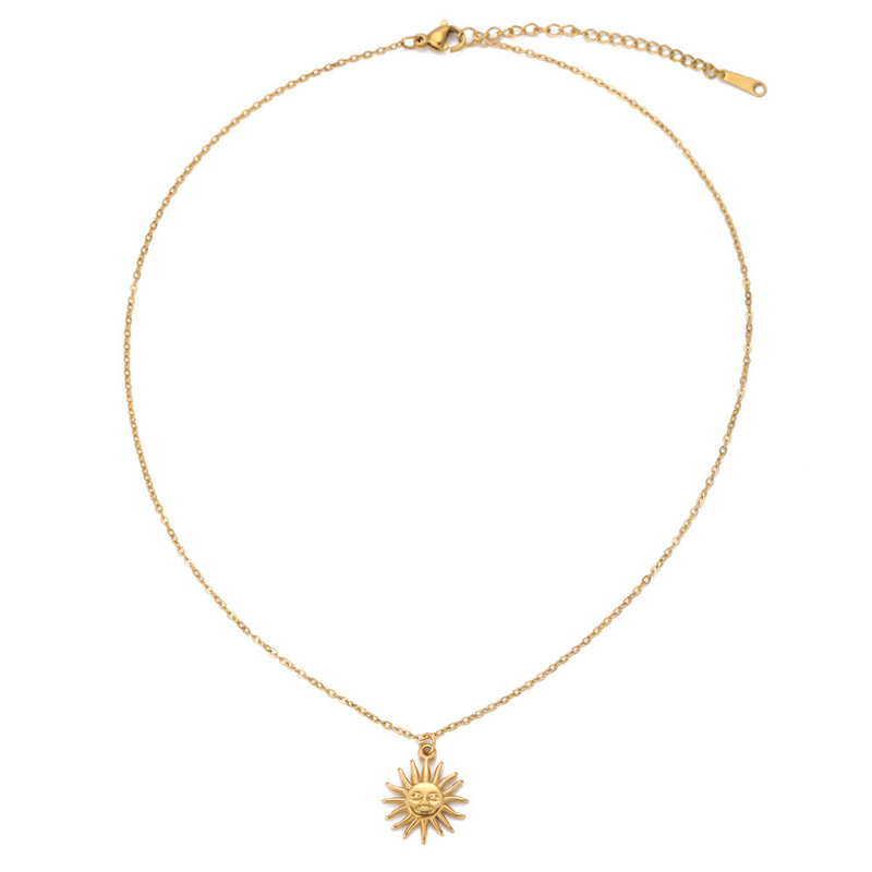 Gold necklace with a sun pendant on a white background
