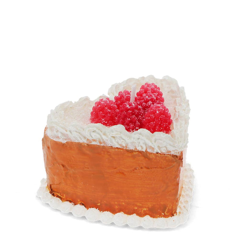 cake slice with whipped cream and a red berry on top against a white background