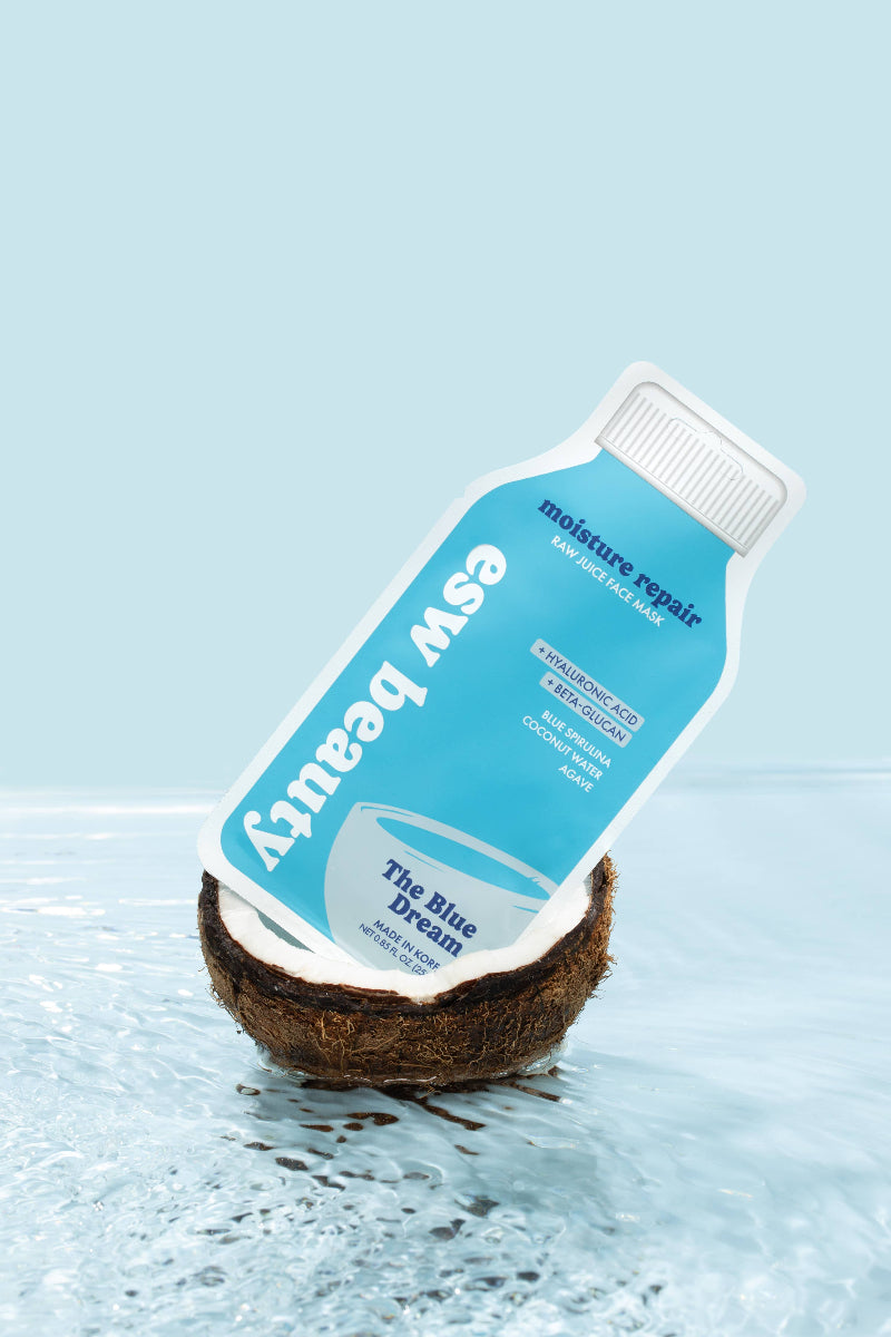 Coconut with a bottle labeled 'Easv Beauty' on a light blue background