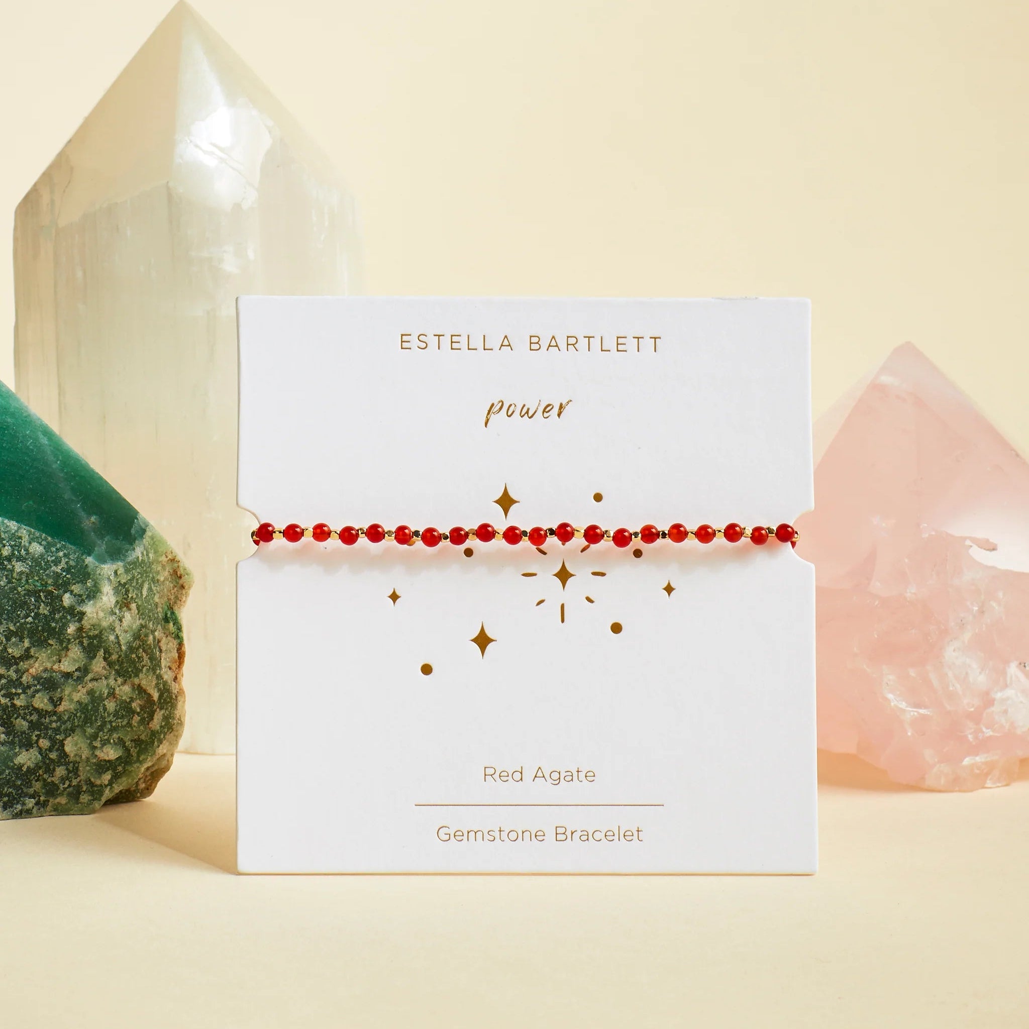 Estella Bartlett gemstone bracelet on a card with crystals in the background