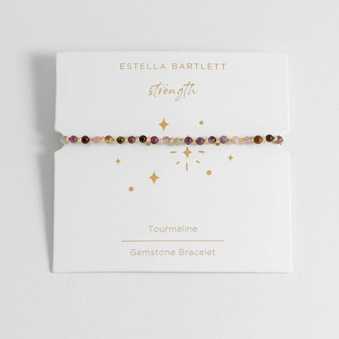 Gemstone bracelet on Estella Bartlett branded card with 'Strength' text
