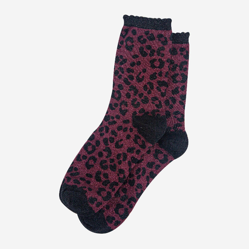 Purple leopard print socks with black accents on a white background