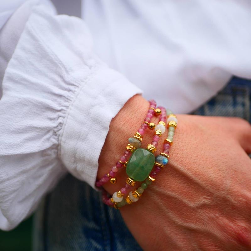 green and pink gemstone bracelets with gold charms