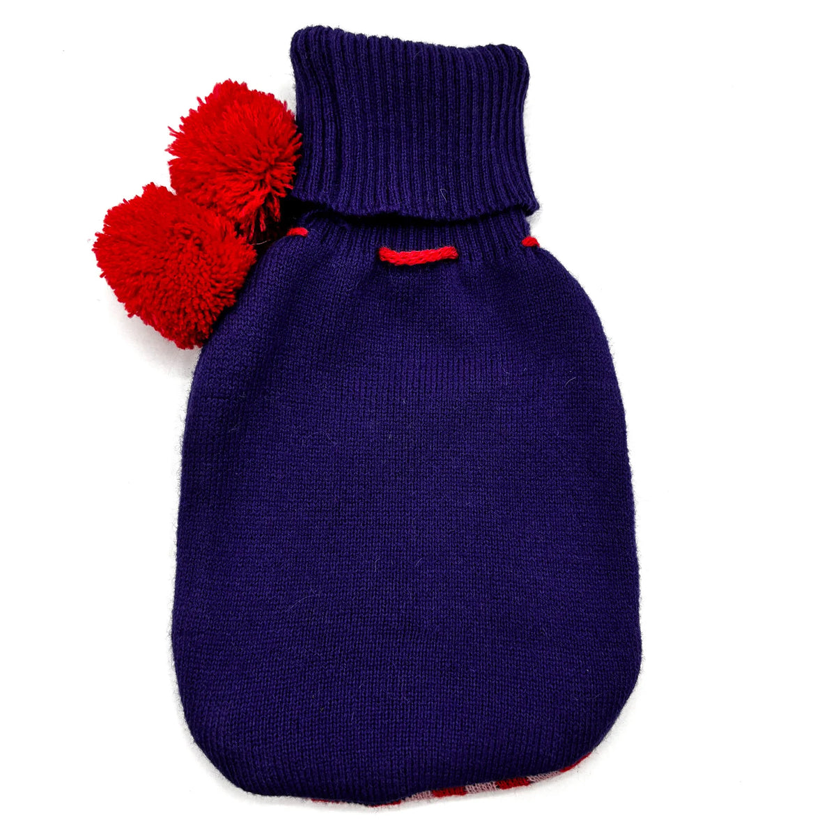 A dark purple knit pet bootie with two bright red pom-poms attached to the collar, shown on a plain white background.