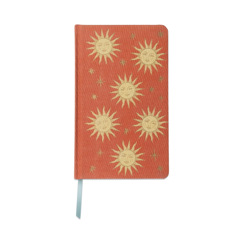 Red notebook with sun designs on a white background