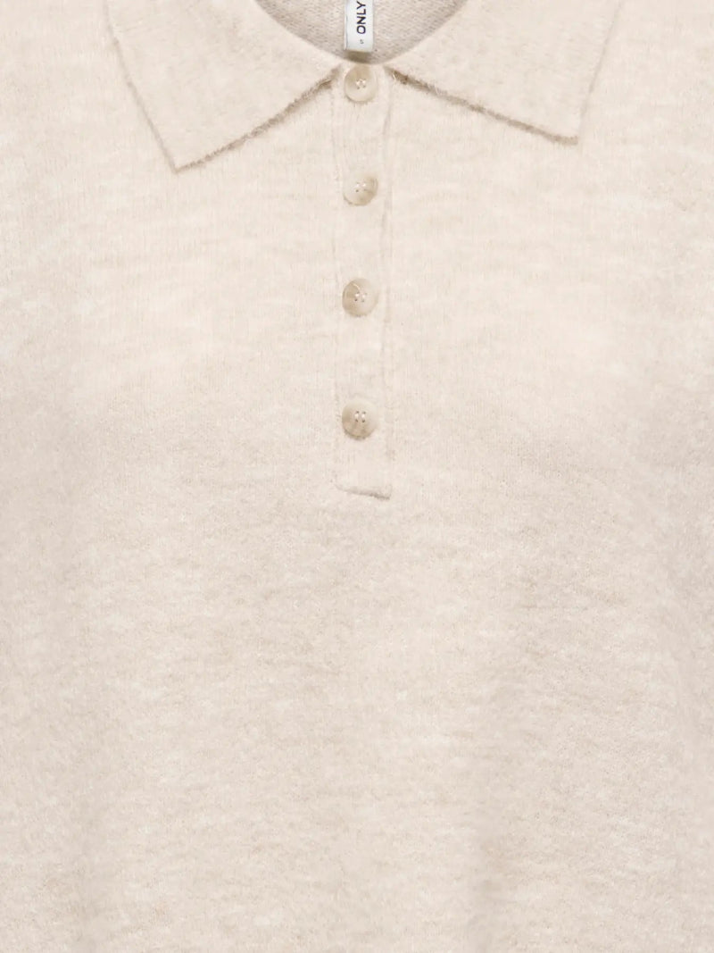 Close-up of a beige knitted polo shirt with buttons